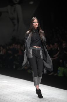 ZAGREB, CROATIA - MARCH 16: Fashion model wears clothes made by Ana Maria Ricov on "Dove FASHION.HR" show on March 16, 2012 in Zagreb, Croatia.