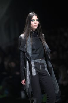 ZAGREB, CROATIA - MARCH 16: Fashion model wears clothes made by Ana Maria Ricov on "Dove FASHION.HR" show on March 16, 2012 in Zagreb, Croatia.