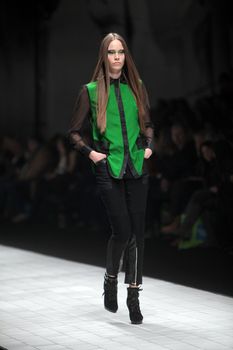 ZAGREB, CROATIA - MARCH 16: Fashion model wears clothes made by Ana Maria Ricov on "Dove FASHION.HR" show on March 16, 2012 in Zagreb, Croatia.