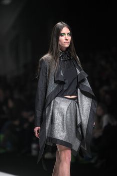 ZAGREB, CROATIA - MARCH 16: Fashion model wears clothes made by Ana Maria Ricov on "Dove FASHION.HR" show on March 16, 2012 in Zagreb, Croatia.