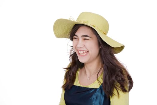 Smiling teen  biracial girl in green dress and lime green hat