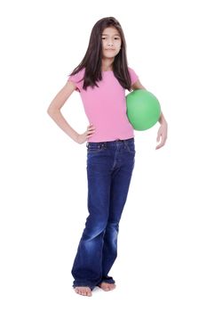 Ten year old Asian girl holding green ball with challenging stance, isolated on white