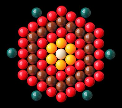 Colorful snooker balls arrange in hexagonal shape with white and yellow balls in center, red, brown, green balls on the periphery