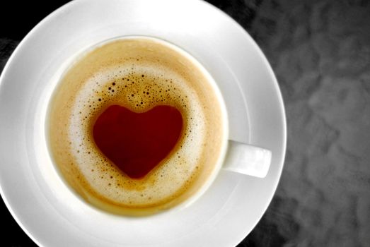 Heart shape inside hot coffee cup