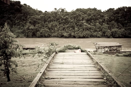 Wooden abandoned dock near a river