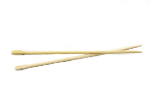 two Japanese wooden chopsticks on a white background