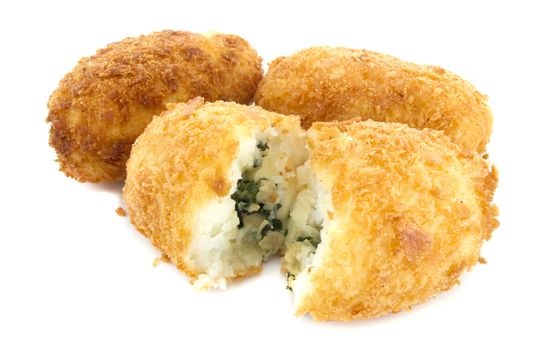 Three croquettes on white background with one is cutting