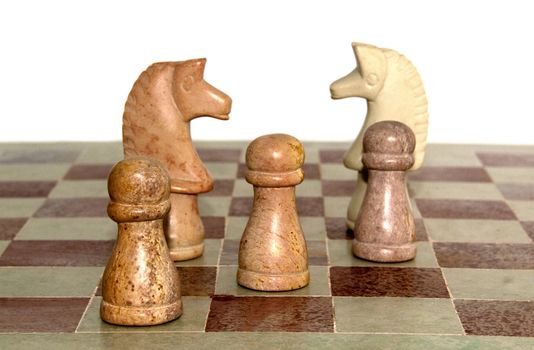 horses and other chess parts on the board