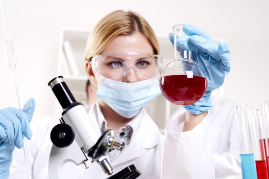 chemist working in the laboratory, mix liquid