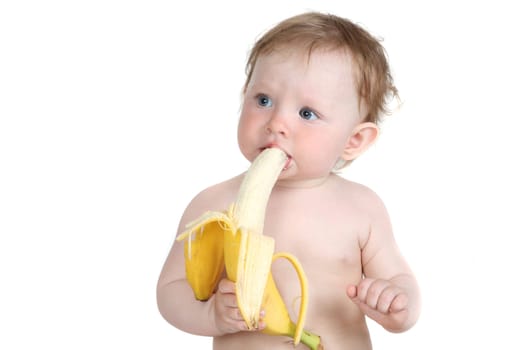 the little blue-eyed girl eats banana. a portrait on a white background. option 5