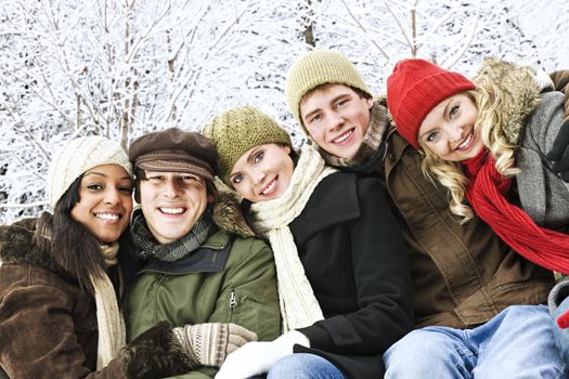 Group of diverse young friends outdoors in winter