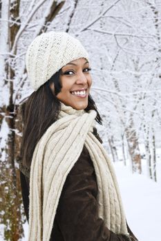 Portrait of happy woman outdoors in winter