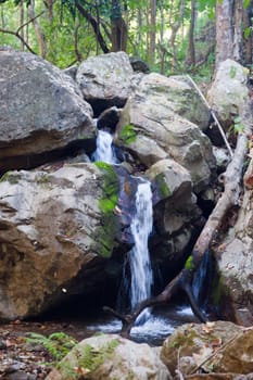 small waterfall cascade in the stream in northern thailand