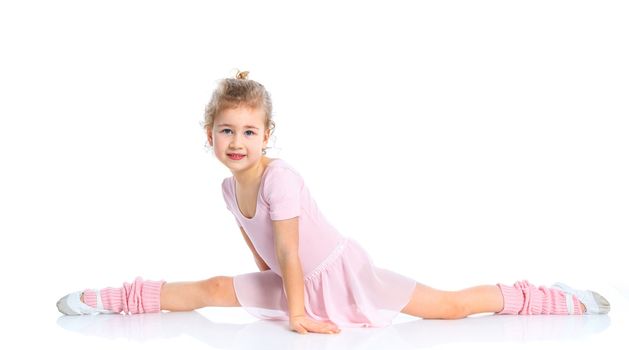 Cute girl gymnast isolated on a white background