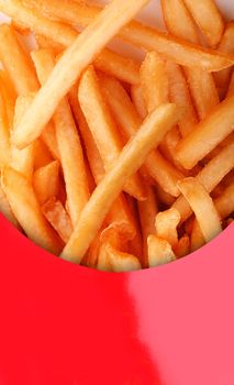 Deep fried potato snack - french fries closeup in a red box