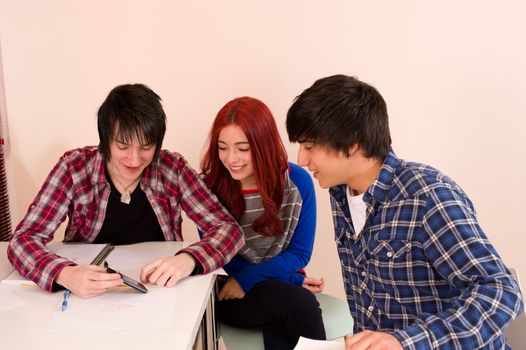 Teenagers and a smartphone inside the classroom