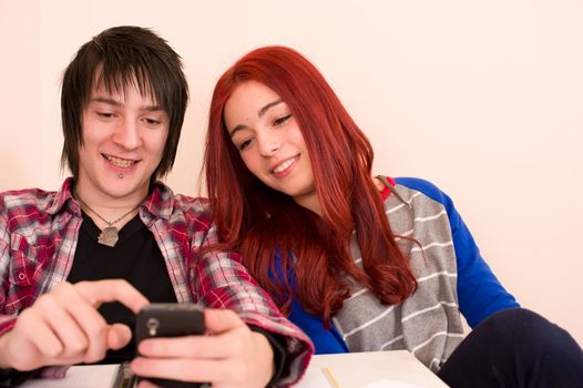Teens reading some content that makes them smile