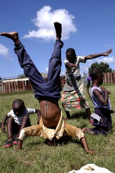 Nairobi,Kenya January 10,2009.Street children play happily in a park.There are many street children in Nairobi.The association Resque Dada was born in Nairobi retrieves them through the streets of the capital to give it a decent life