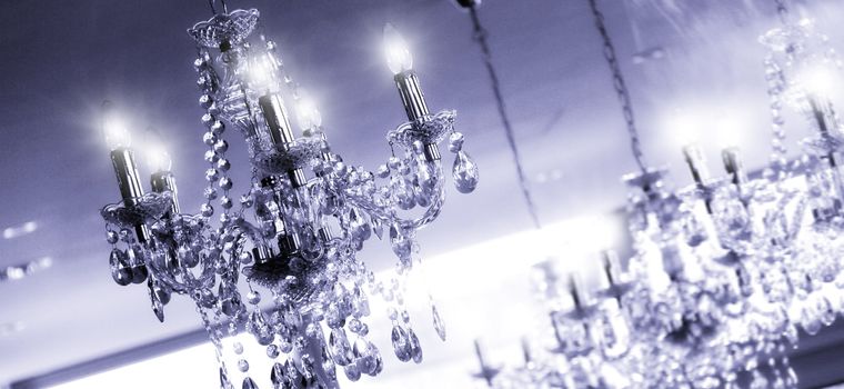 any chandeliers on the ceiling of a luxury room