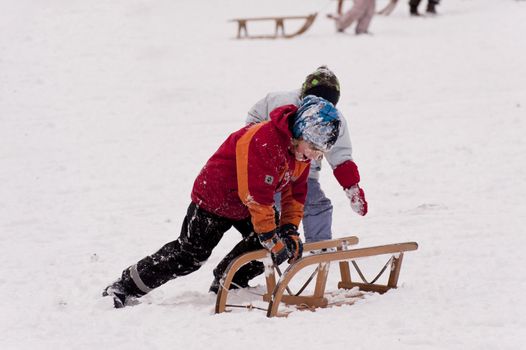 sledding in a snow covered landscape