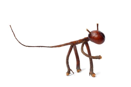 Toy made from chestnuts and matches on white background