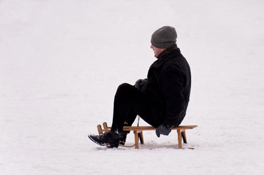 sledding in a snow covered landscape
