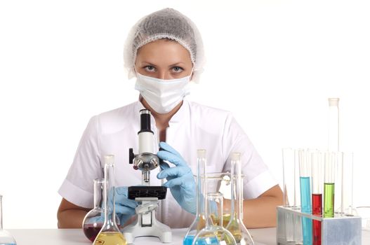 portrait young woman scientist working with microscope