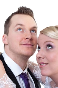 Bride and groom looking above