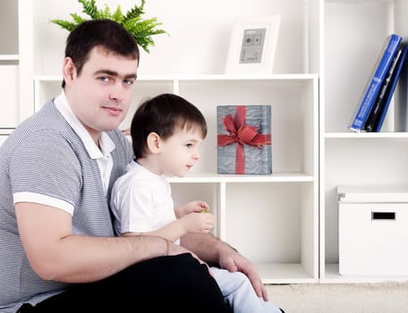 Father and son spend time together, playing at home