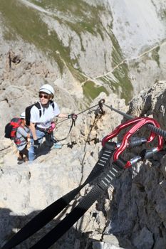 hiker in Roda di Vael Via ferrata, Italian Dolomites