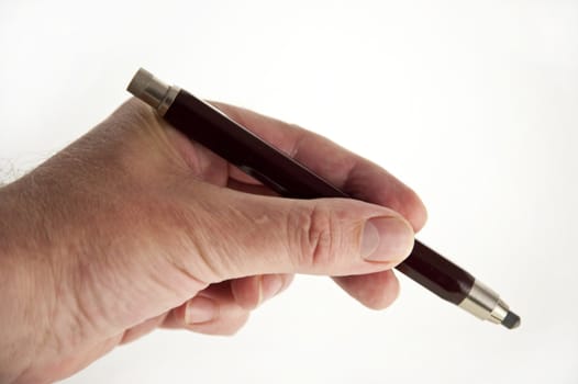close up of a hand with pencil