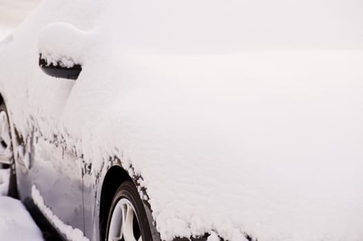 Snow covered car