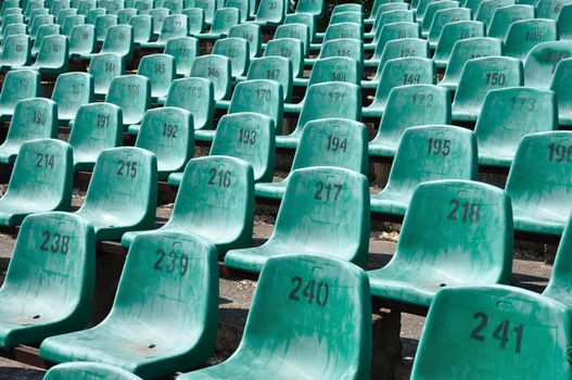 Green numbered seats at a stadium