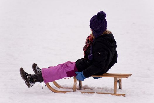 sledding in a snow covered landscape
