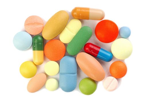 Macro of pills on white background