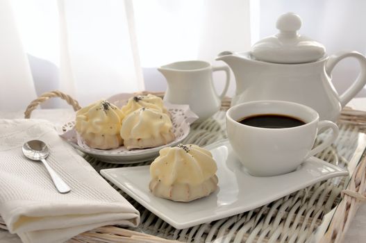 Cookies with zefirnoy filling in milk glaze with a cup of coffee