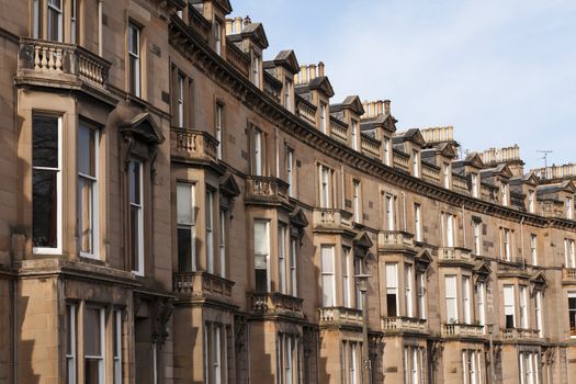 Traditional Gregorian flats in a row, shaped in a bow form.