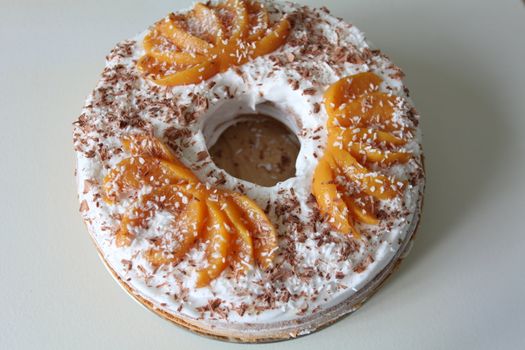 sponge cake with apricot cream and grated chocolate