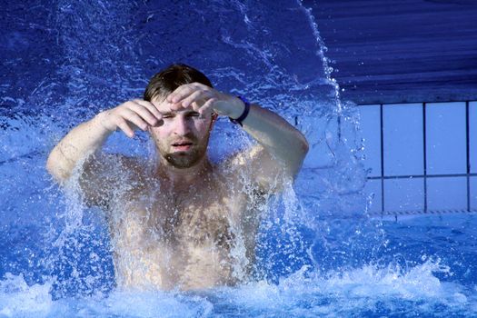 young attractive man relax in spa area