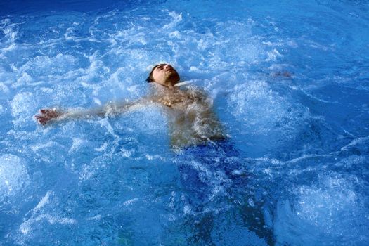 young attractive man relax in spa area