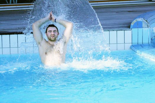 young attractive man relax in spa area