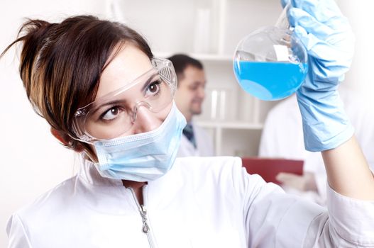 chemist working in the laboratory, mix liquid