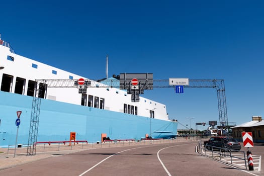 entry to the ferry port with a ferry in the background