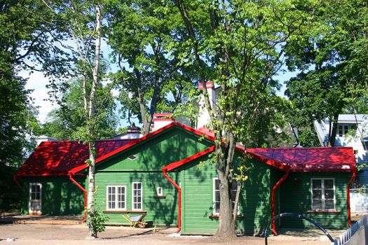 Small house garden in green wood