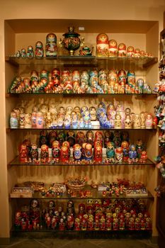 Nested dolls in a case, behind glass