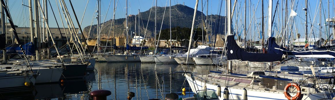 Panorama of Harbor in Palermo with mountain backdrop. Sicily- Italy