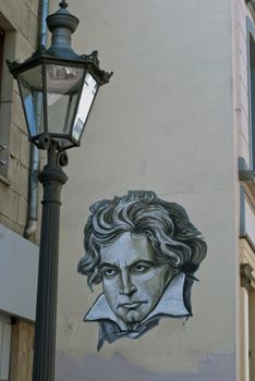 Portrait of Ludwig van Beethoven on the house wall opposite of Beethoven's Birth-House in Bonn, Germany