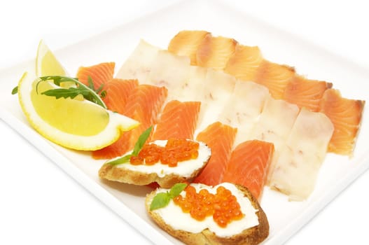 a plate of fish and caviar on a white background