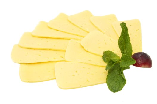 cheese is sliced and decorated with radishes and mint on a white background