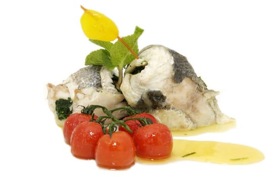 baked fish with cherry tomatoes on a white background